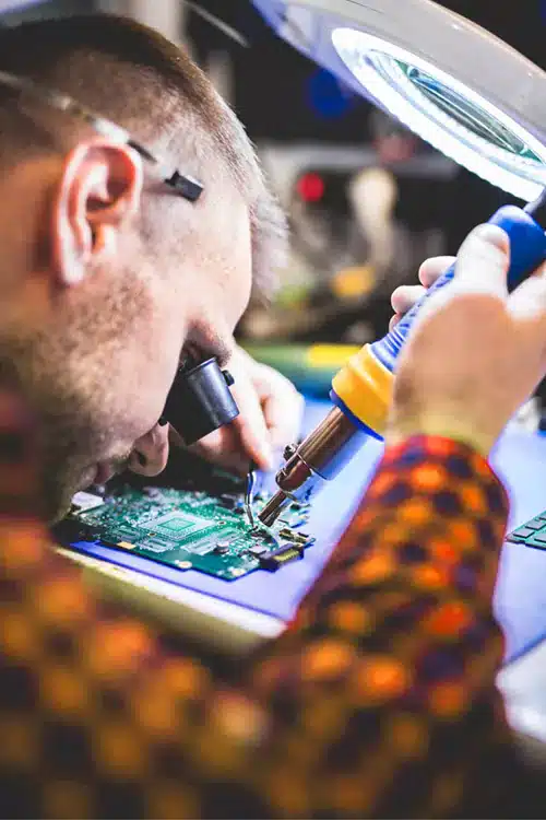 Close-up of soldering a circuit board