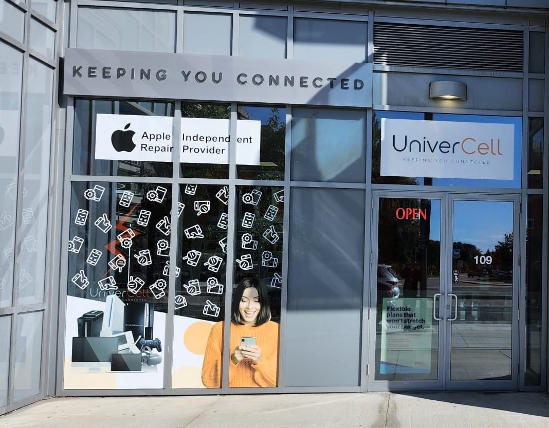 UniverCell store front with 'Keeping You Connected' sign